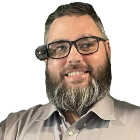Photo of Bryan smiling and wearing the AlEye glasses